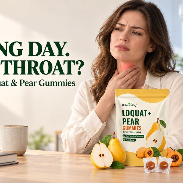 Woman touching her dry throat in an air-conditioned office, with Nature’s Key Loquat & Pear Gummies on the desk.